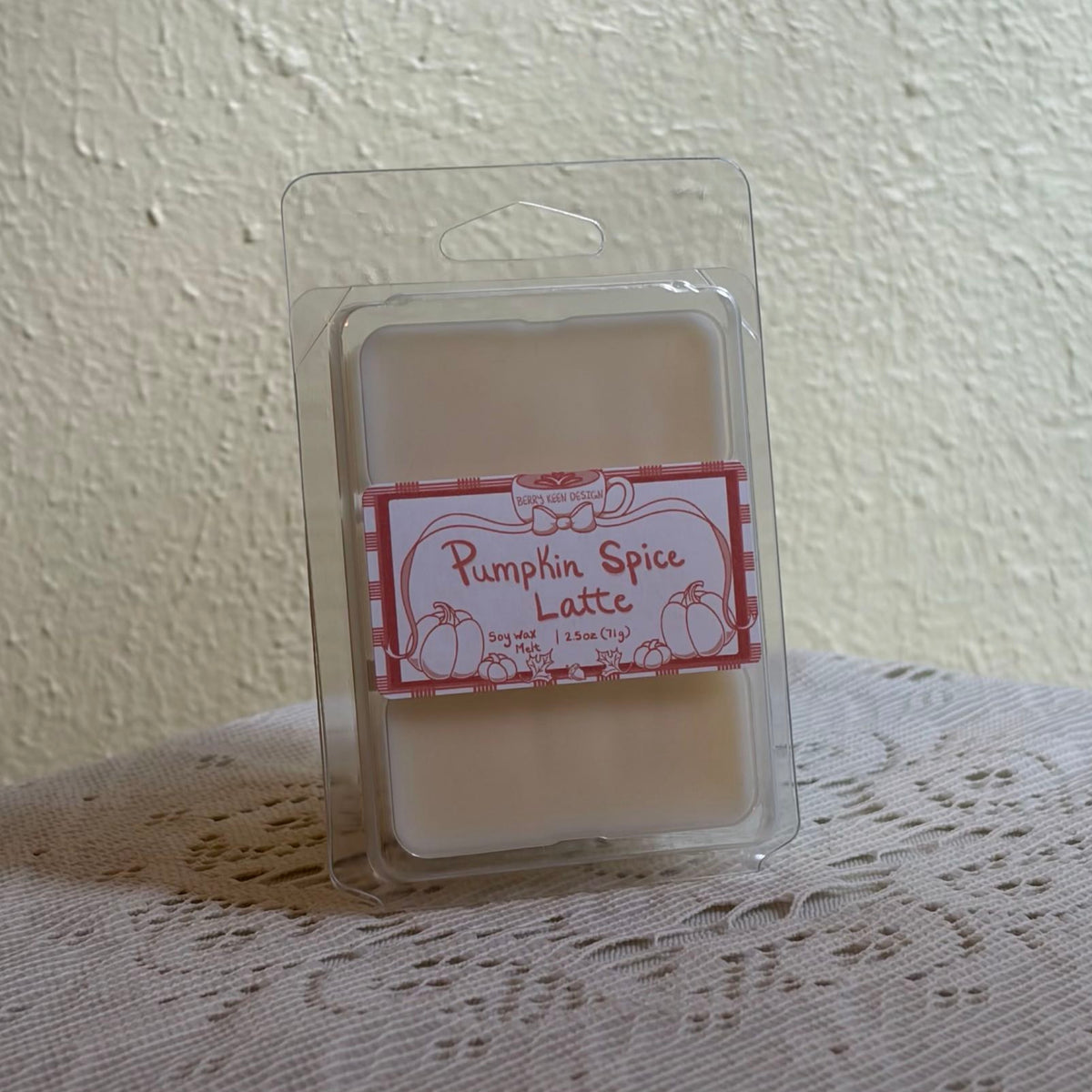 Pumpkin spice wax melt on a lace tablecloth