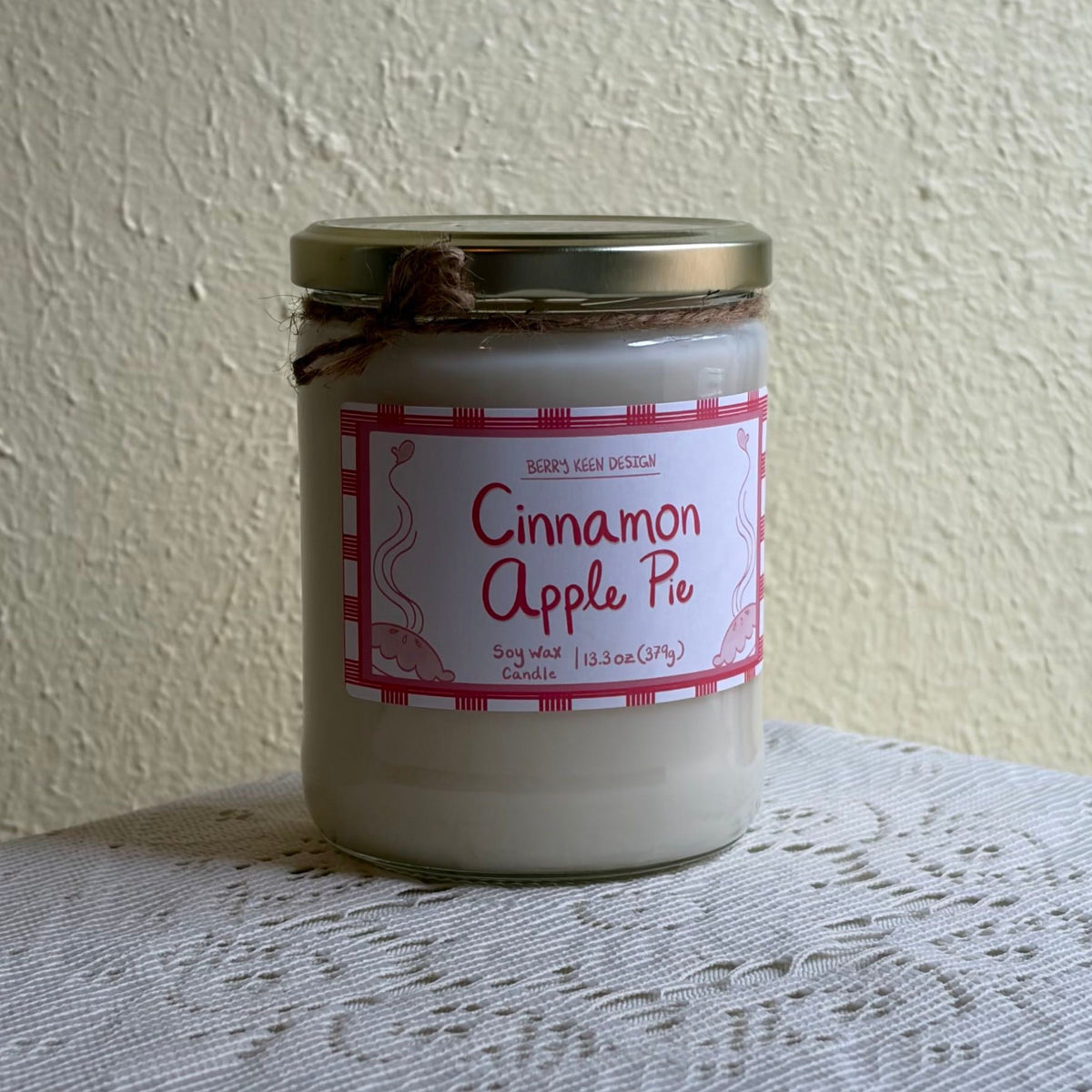 Cinnamon Apple Pie candle on a lace table cloth