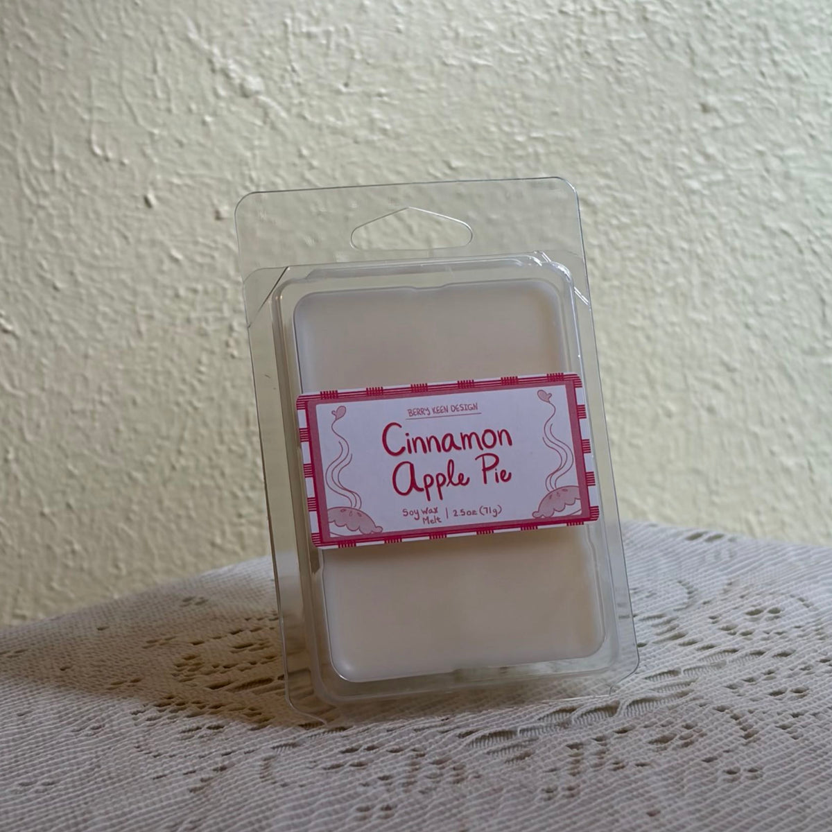 Cinnamon apple pie wax melt on a lace table cloth