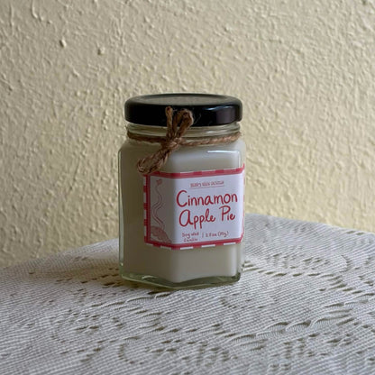 Cinnamon Apple Pie 2.8oz candle on a lace table cloth