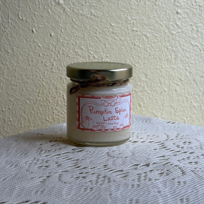 Pumpkin spice candle 3.4oz on a lace tablecloth