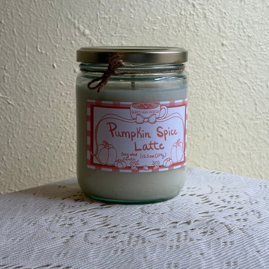 Pumpkin spice candle 13.3oz on a lace tablecloth