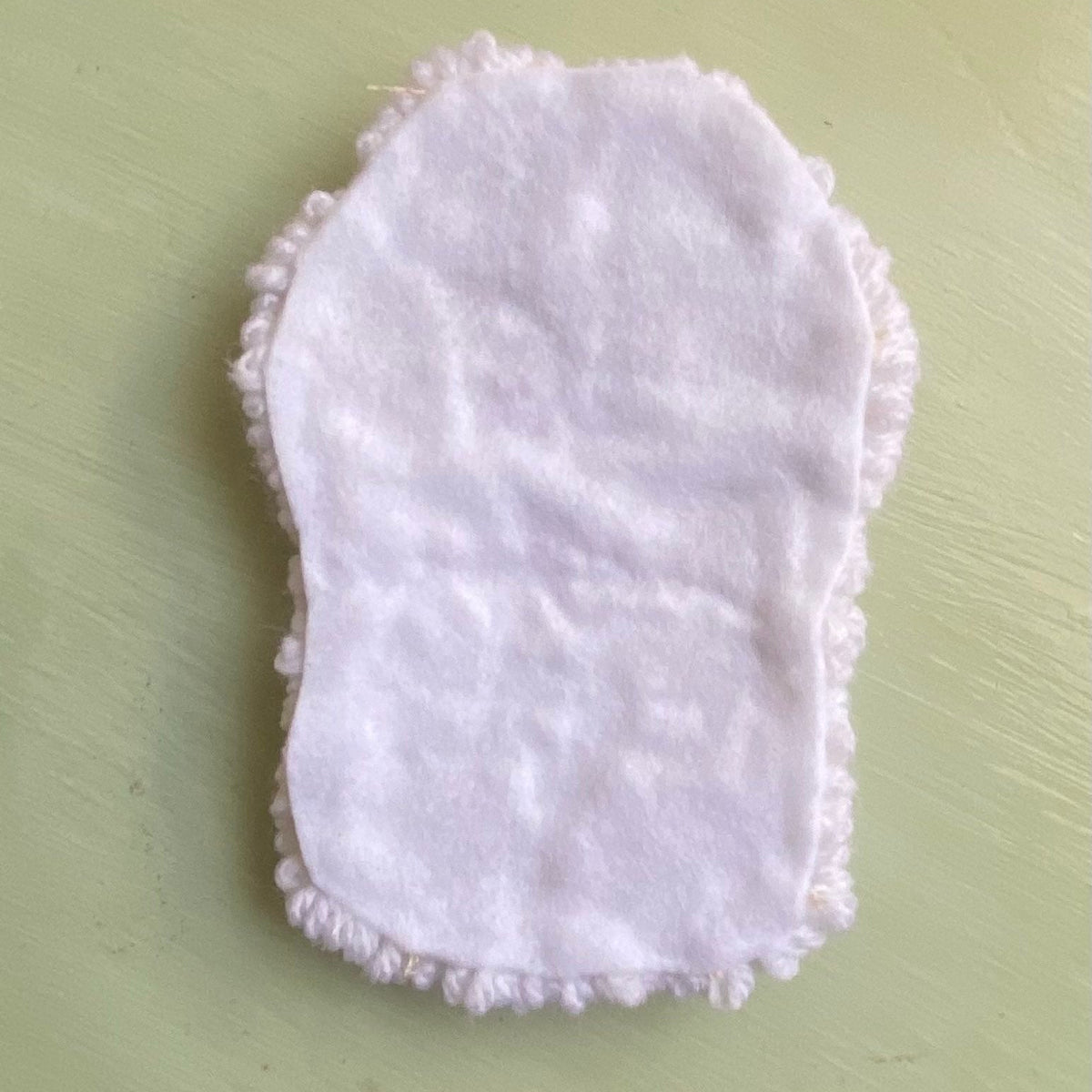 Back of the Punch needle coaster covered in felt